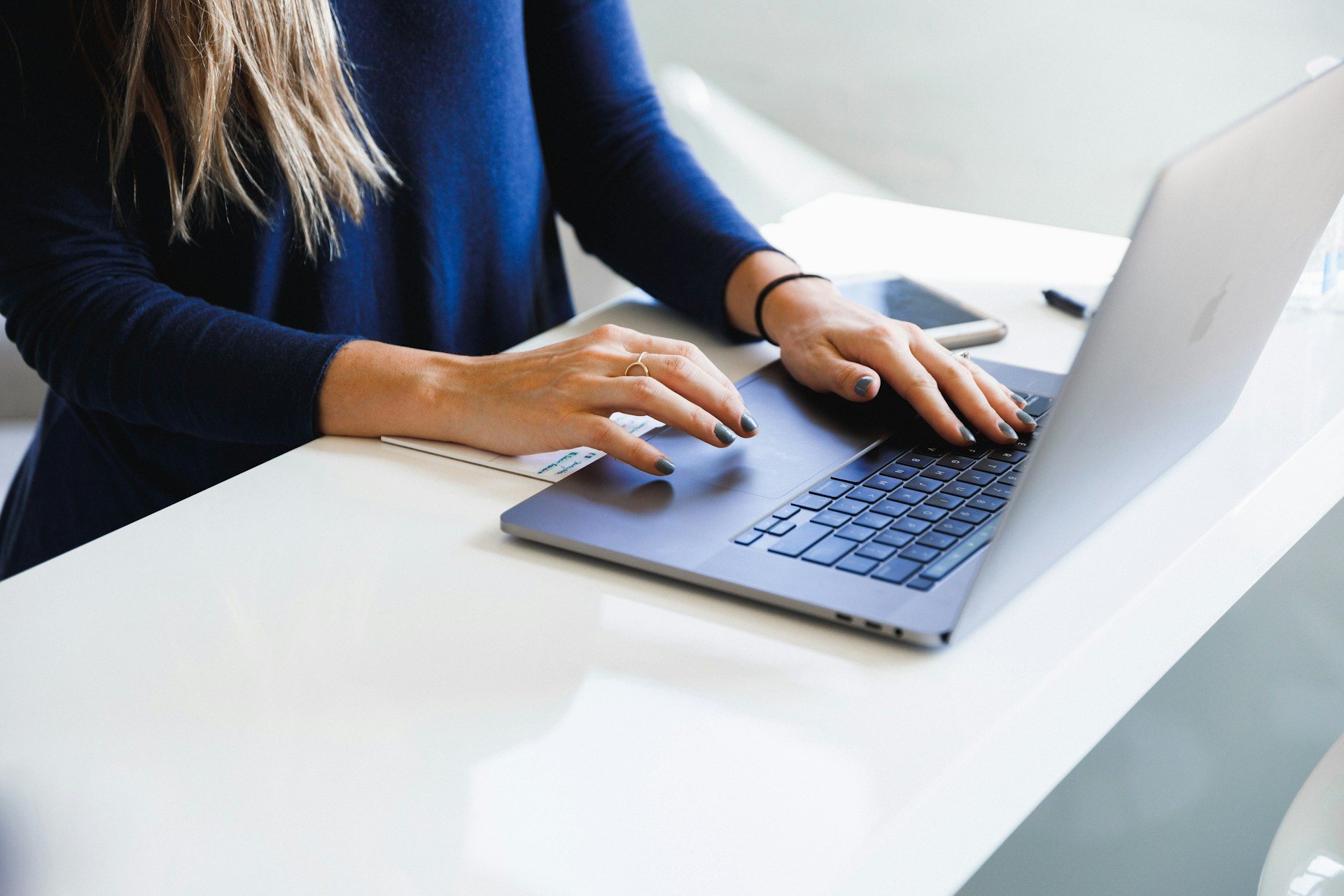 Woman typing on a computer